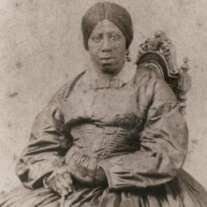 Portrait of Anna Murray Douglass. She is sitting, with her hands in her lap. She is facing the viewer. Image courtesy of National Park Service.