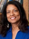 Woman with dark long hair wearing a blue shirt